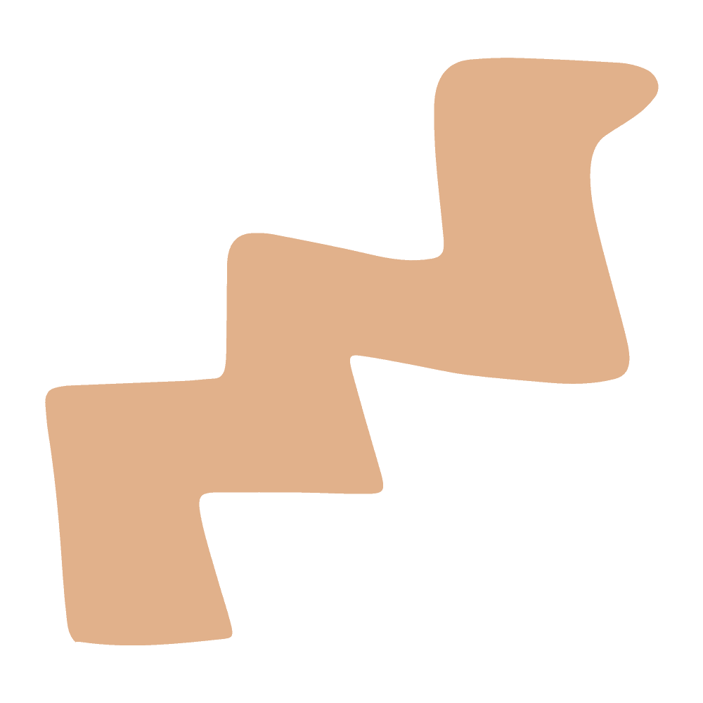 Close-up of a beige, zigzag-shaped object on a black background.